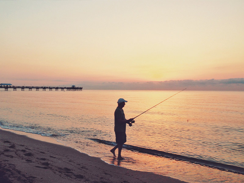 man fishing at sunset guaranteed income santa rosa ca
