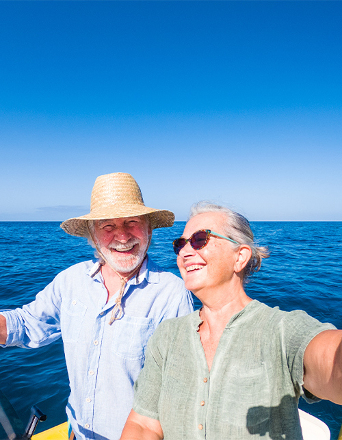 happy smiling senior couple boat ride index annuities